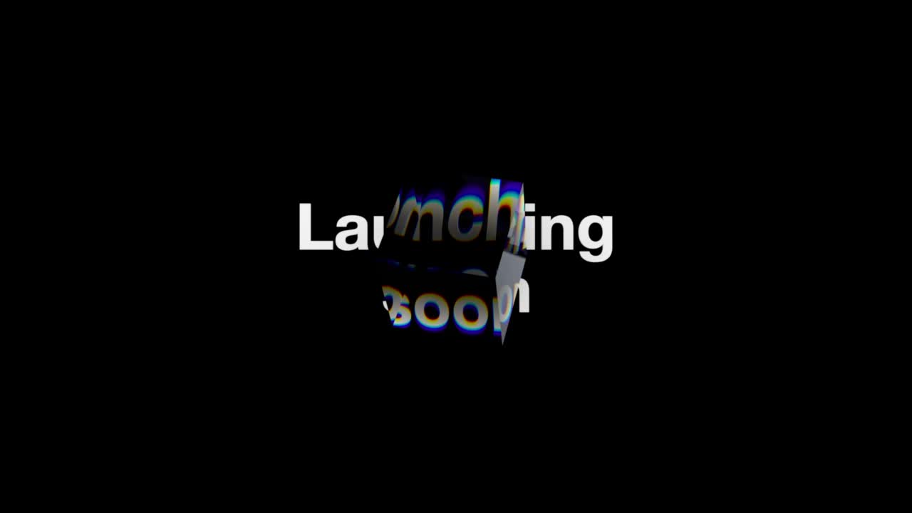 a video of the text "launching soon" with a clear cube moving over the text